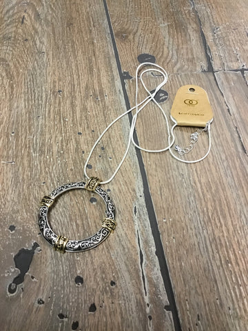 Necklace, filigree etched circle of life