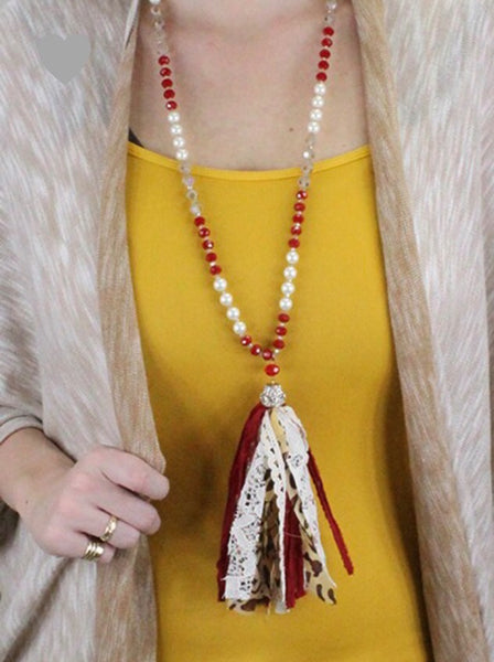 Red beaded necklace with leopard tassel