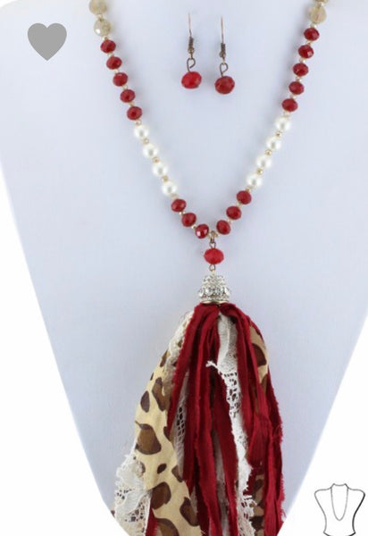 Red beaded necklace with leopard tassel