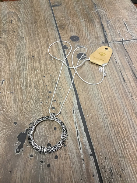 Necklace, filigree etched circle of life