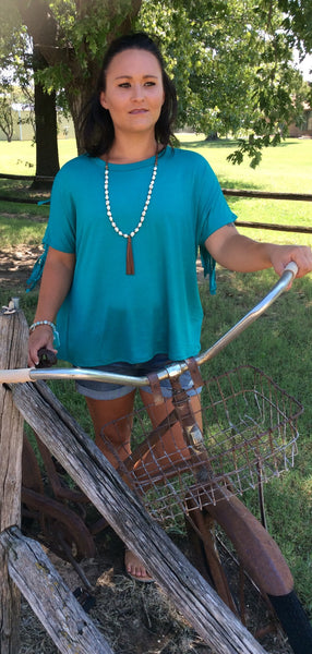 short sleeve dark jade top with fringe detail